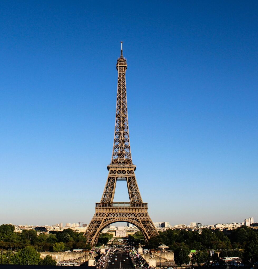 Stunning daylight shot capturing the Eiffel Tower with clear blue skies in Paris.